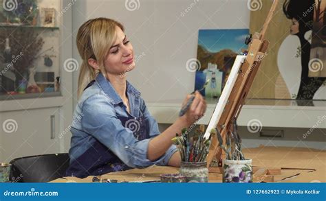 Gorgeous Young Female Artist Working On Her Painting At The Art Studio