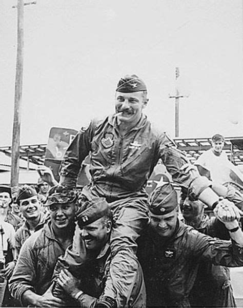 Photograph Of Colonel Robin Olds Being Carried Away From His F 4