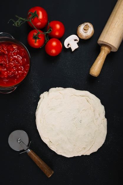 Free Photo Ingredients And Utensils Near Pizza Dough