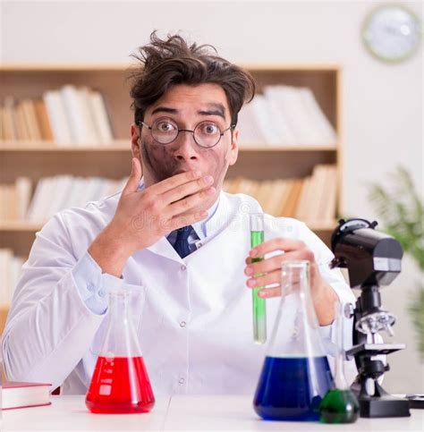 Mad Crazy Scientist Doctor Doing Experiments In A Laboratory Stock