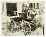 George B. Selden in his first automobile, 1877. - NYPL Digital Collections