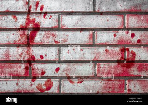 Bloody Handprints And Blotches Of Blood On Grunge Wall Background For