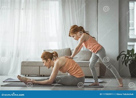Daughter Is Helping Mom To Do Stretching Exercise Stock Image Image