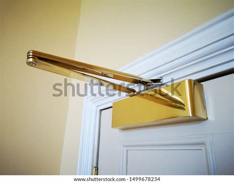 Gold Brass Overhead Door Closer Mechanism Stock Photo 1499678234