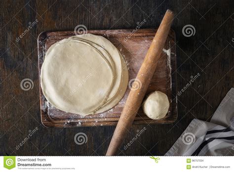 Raw Fresh Dough On A Wooden Board With Rolling Pin Stock Photo Image