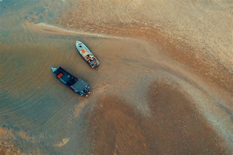Birds Eye View Of Two Boats On Water Near Shore · Free Stock Photo
