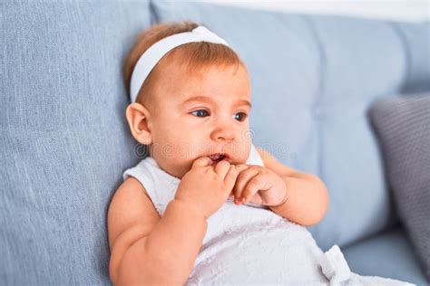 Adorable Baby Lying Down On The Sofa At Home Stock Image Image Of