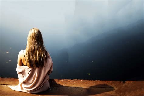 A Sad Girl Sitting Alone Wallpaper