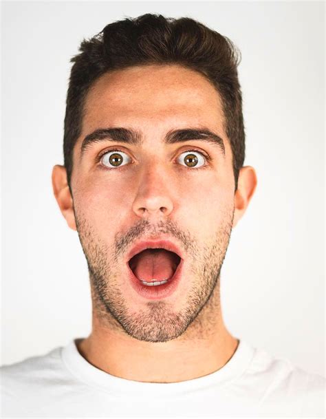 A Man Making A Surprised Face With His Mouth Open