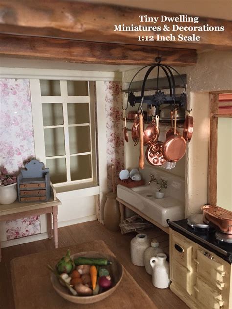 It has a kitchen island topped with a black granite counter and. Miniature Copper Cookware, Miniature Pot Rack, Dollhouse ...