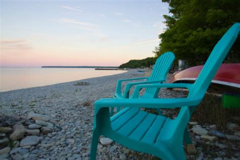 Empty Adirondack Chairs On The Beach Stock Photo Download Image Now