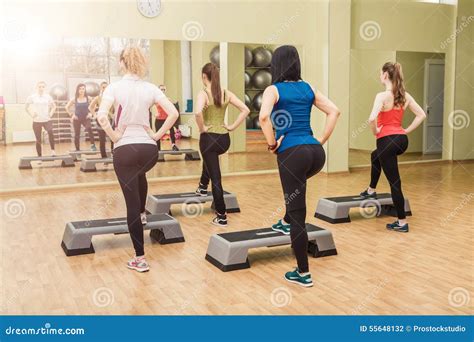 Group Of Women Making Step Aerobics From The Backside Stock Photo