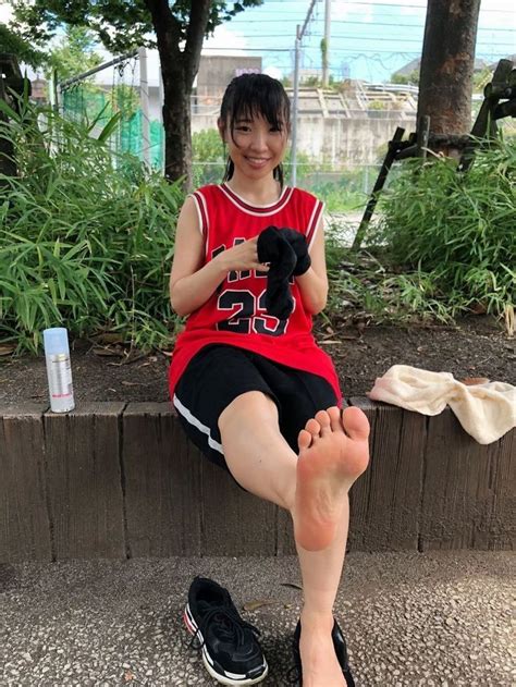 asian girl takes off her black sneakers and shows her feet r asianfeet2