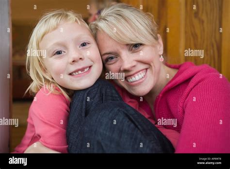 Portrait Of Mother And Six Year Old Daughter Smiling Stock Photo Alamy
