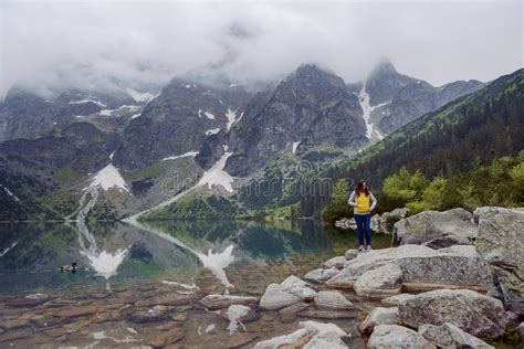 Woman Relaxing On The Lake And Mountains Sunny Landscape Stock Image