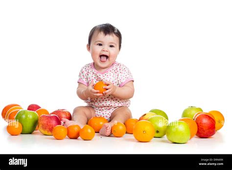 Baby Girl Eating Fruits Stock Photo Alamy