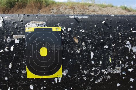 Shooting Range Target With Bullet Holes At A Gun Range Stock Photo