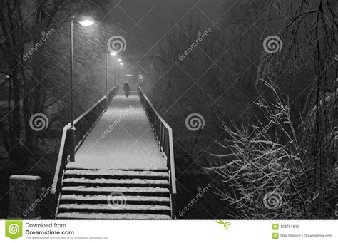 Man On A Pedestrian Bridge In The Snow Stock Photo Image Of City