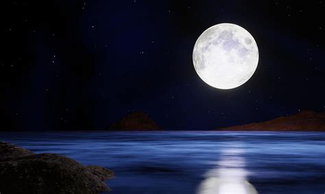 The Blue Full Moon Is Reflected In The Sea A Wave Of Water From The
