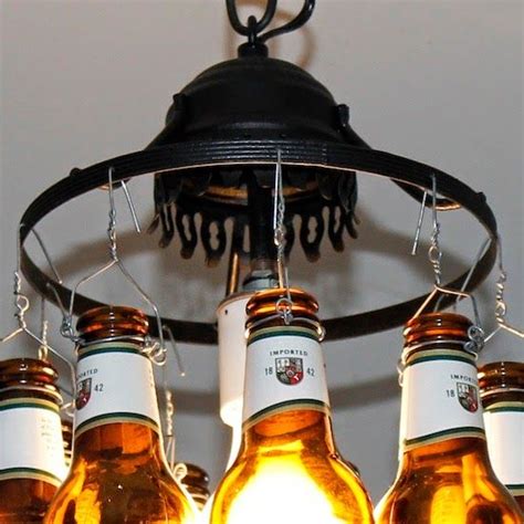 Traditionally, chandeliers were large ceiling lights that required a huge space; Beer Bottle Lamp | Do it yourself ideas and projects | Beer bottle lamp, Beer bottle chandelier ...