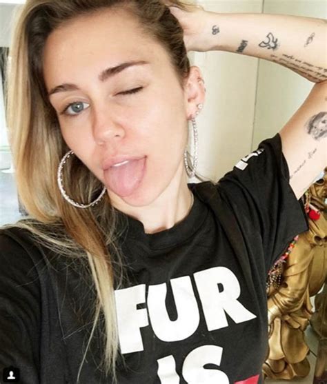 Miley Cyrus Singer Unloads Assets In Plunging Leopard Print Top Daily Star