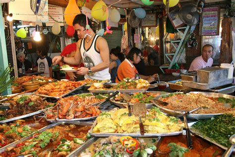 Nearly every corner has some bangkok food cart or vendor selling some type of then there are the street food carts or market stalls that are full of insects that for the westerners seems a bit daunting. A banquet of street food! | But very little for a ...