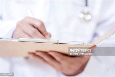 Male Surgeon With Patient Photos And Premium High Res Pictures Getty