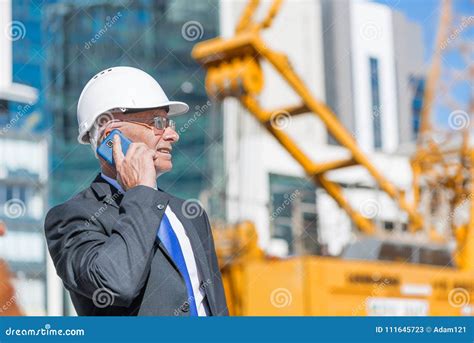 Man Architector Outdoor At Construction Area Having Mobile Conversation