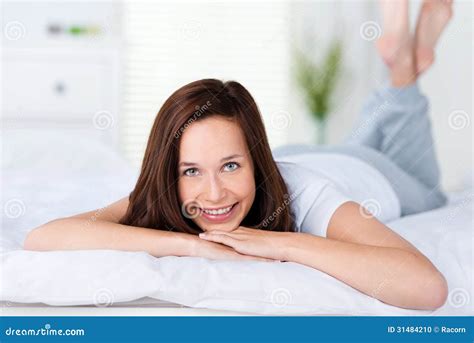 Smiling Woman Lying On Her Bed Stock Photo Image Of Cheerful Funny