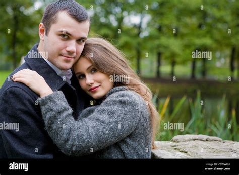 Two Young Lovers Enjoying Each Other In Park Stock Photo Alamy