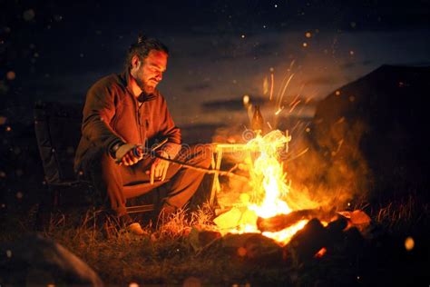 Smiling Man Next To A Bonfire In The Dark Stock Photo Image Of Nature
