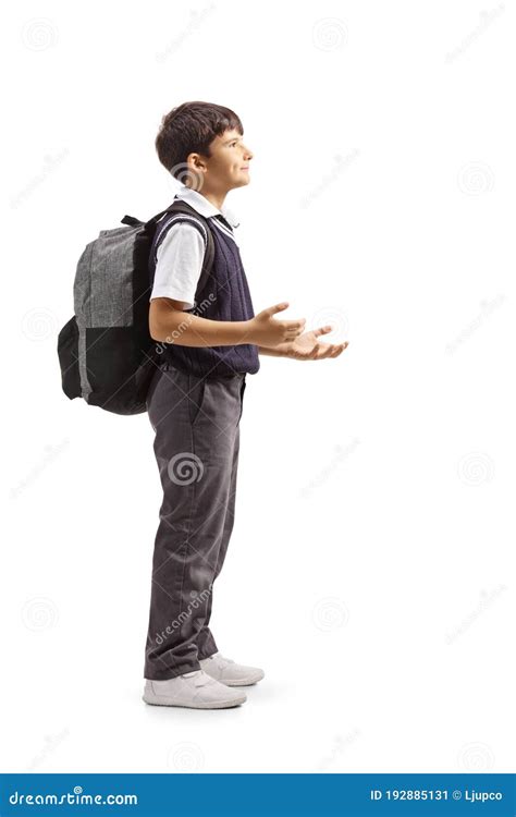 Schoolboy In A Uniform Standing And Gesturing With Hands Stock Image