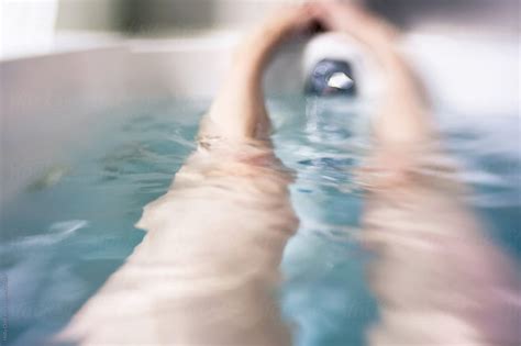 Woman S Legs In A Bathtub Filled With Water Stocksy United