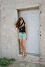 Girl standing in doorway by michelle edmonds - Stocksy United