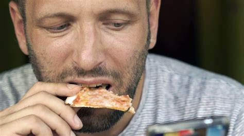 Man Smartphone Eat Pizza R Hd Stock Video Footage Storyblocks