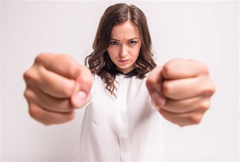 Premium Photo Young And Angry Woman Is Clenching Her Fists In Rage