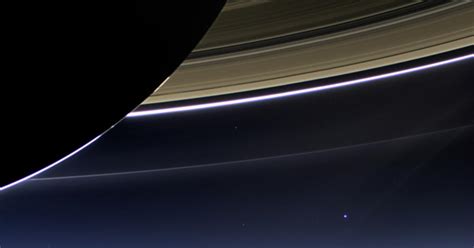 nasa s cassini beams back stunning pictures of saturn earth cbs news