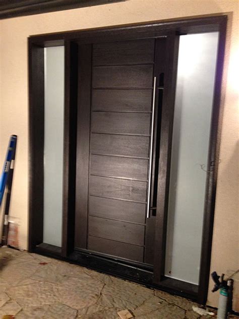 modern contemporary front entry fiberglass door  multi point locks  frostes side lites