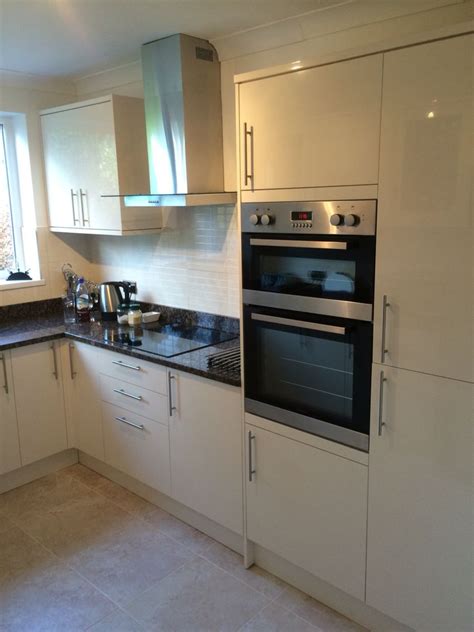 Maybe you would like to learn more about one of these? Cream gloss Howdens kitchen Baltic brown granite tops ...