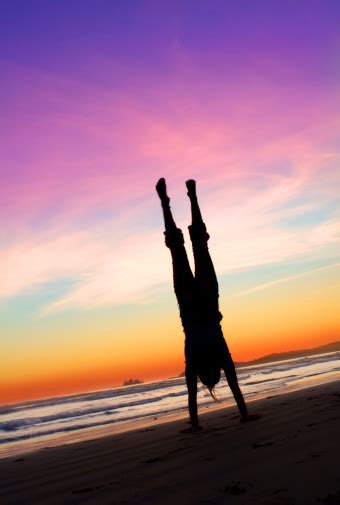 Handstand Girl In Silhouette At Sunset Beach Stock Photo Download
