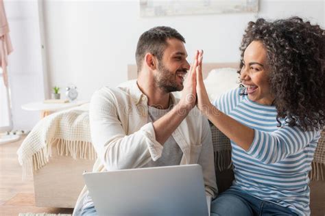 Happy Interracial Couple Smiling While Giving Stock Image Image Of