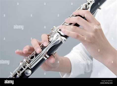 Hands Holding Clarinet Stock Photo Royalty Free Image 23463919 Alamy