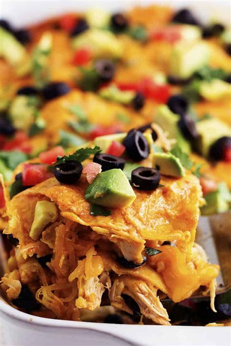 Layer half of the soup/sauce mixture on the tortillas, then half of the cheese, then sprinkle on diced onions if desired. Loaded Stacked Chicken Enchilada Casserole | The Recipe Critic