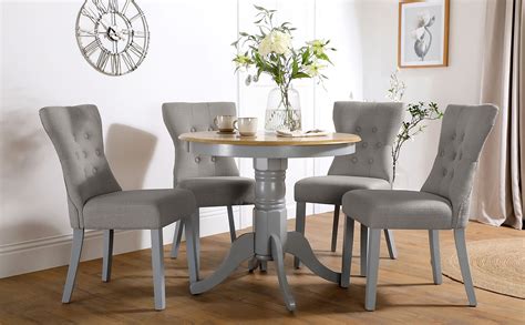Glass and oak dining tables. Kingston Round Painted Grey and Oak Dining Table with 4 Bewley Light Grey Fabric Chairs ...