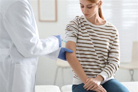 Doctor Giving Injection To Patient Vaccination Concept Stock Image