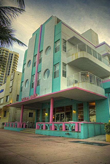 A Multi Colored Building With Balconies On The Top Floor