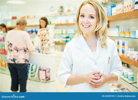 Pharmacist Chemist Woman Working In Pharmacy Drugstore Stock Photo