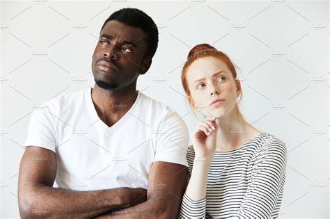 Interracial Couple Young Redhead Caucasian Female And African Man In White T Shirt Standing