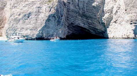 Blue Water Black Cave Photo From Navagio In Zakynthos