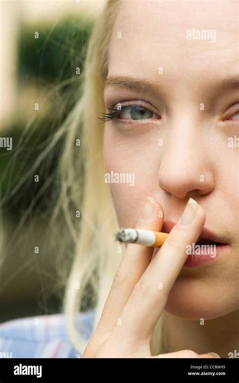 Young Woman Smoking Cigarette Stock Photo Alamy